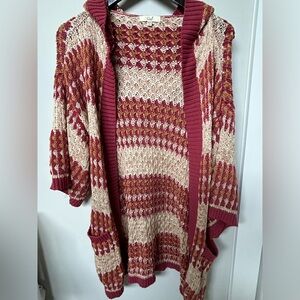 Women’s hooded cardigan. Mid length sleeves